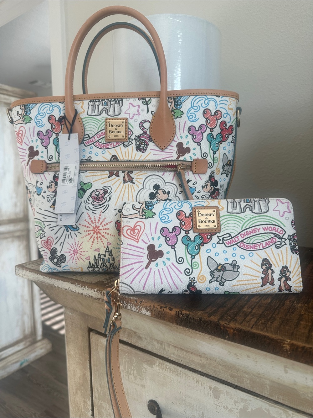 DisneyDooney & Bourke White Disney Sketch Tote with Multicolor wristlet Wallet.